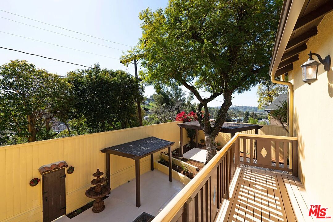 3932 Roderick Road Los Angeles, CA 90065 - Photo 22 of 43 a view of balcony with wooden floor and barbeque oven