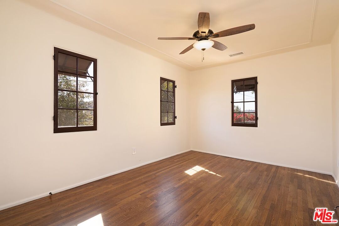 3932 Roderick Road Los Angeles, CA 90065 - Photo 23 of 43 a view of a big room with wooden floor and windows