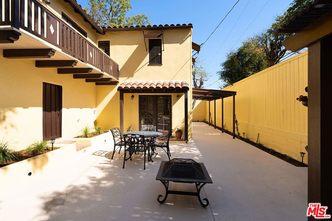 3932 Roderick Road Los Angeles, CA 90065 - Photo 31 of 43 a view of a patio with table and chairs with wooden floor and fence
