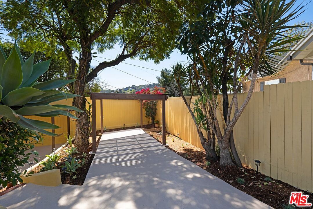 3932 Roderick Road Los Angeles, CA 90065 - Photo 38 of 43 a view of a pathway of a house with large trees