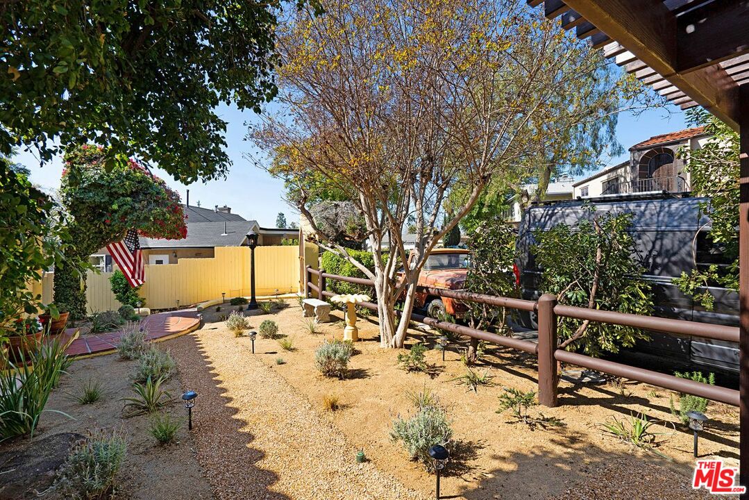 3932 Roderick Road Los Angeles, CA 90065 - Photo 5 of 43 a view of a backyard with wooden fence and large trees
