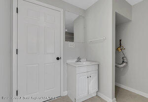 1429 Lakewood Road Manasquan, NJ 08736 - Photo 13 of 26 a bathroom with a sink toilet and