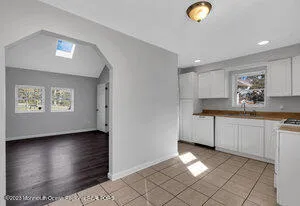 a kitchen with a sink cabinets and window