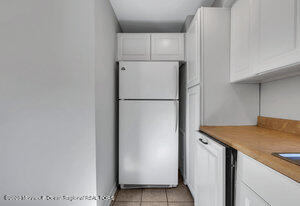 1429 Lakewood Road Manasquan, NJ 08736 - Photo 16 of 26 a white refrigerator freezer sitting inside of a kitchen