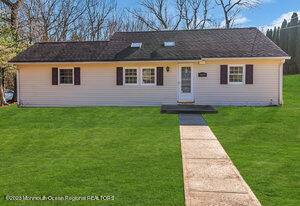 1429 Lakewood Road Manasquan, NJ 08736 - Photo 2 of 26 a backyard of a house with lots of green space