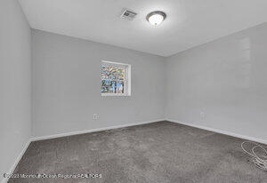 1429 Lakewood Road Manasquan, NJ 08736 - Photo 21 of 26 an empty room with a empty space and window