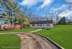 1429 Lakewood Road Manasquan, NJ 08736 - Photo 3 of 26 a view of a house with a yard
