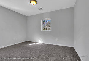 1429 Lakewood Road Manasquan, NJ 08736 - Photo 8 of 26 a view of an empty room with window and closet