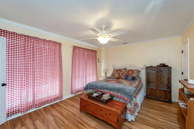 a view of a livingroom with furniture flat screen tv and staircase