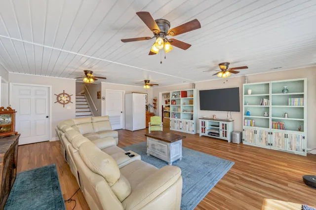 a view of an entryway with wooden floor