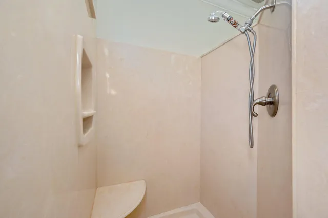 a view of a room with furniture wooden floor and windows