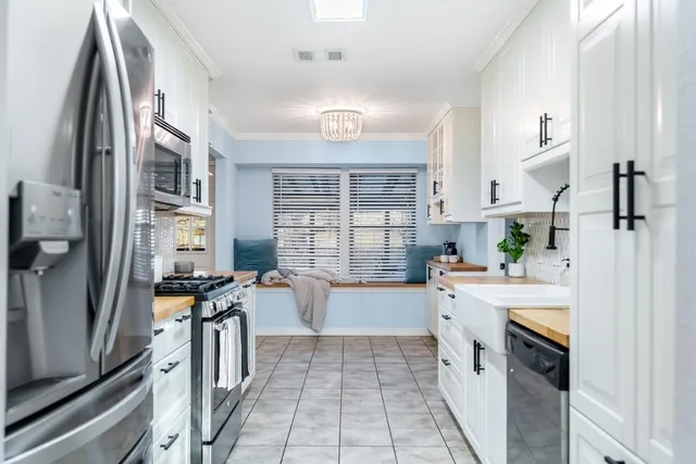 a kitchen with a table and chairs