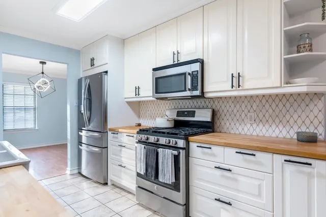 a view of a kitchen with furniture and staircase