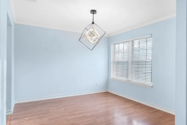 a kitchen with a sink appliances cabinets and a counter top space