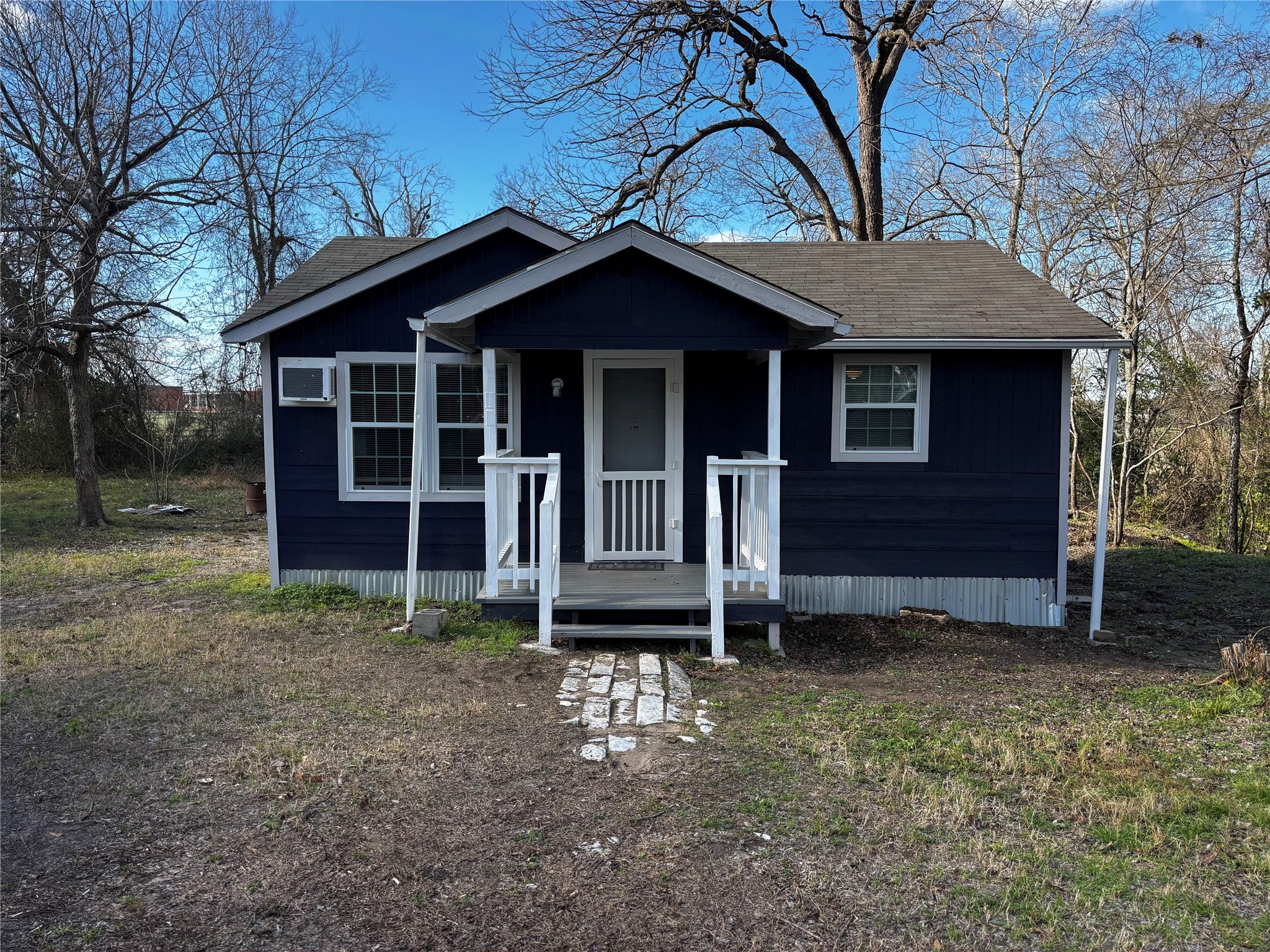 100B Ross Street, Unit B Huntsville, TX 77320 - Photo 1 of 22 a front view of a house with a garden
