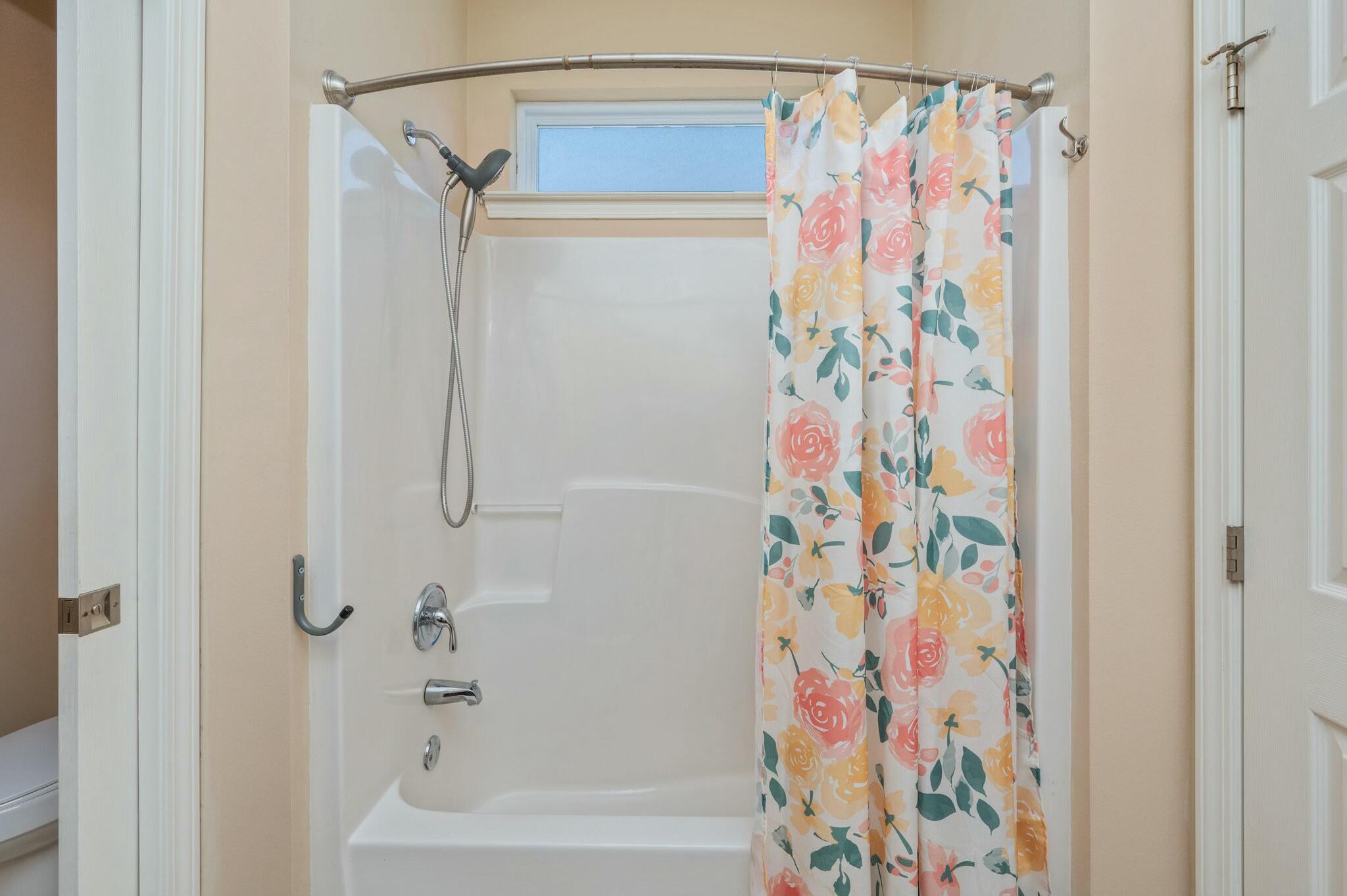 202 Ladue Avenue Crestview, FL 32539 - Photo 19 of 33 a bathroom with a shower curtain and a curtain