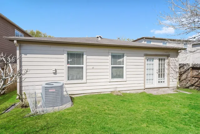 a view of a house with a backyard