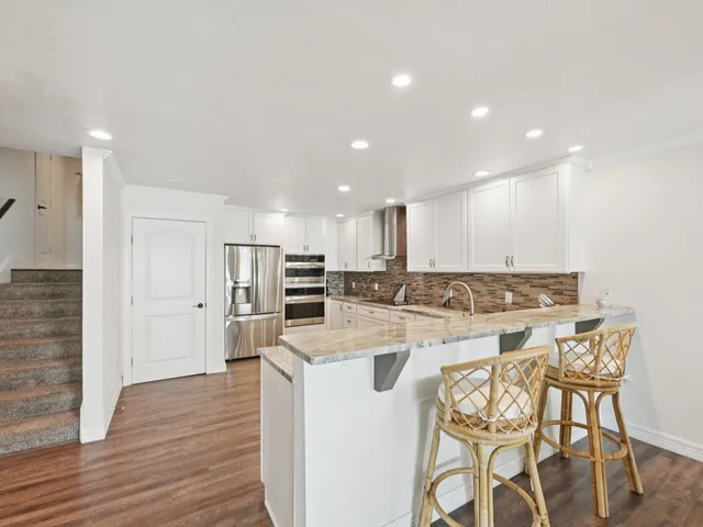 a kitchen with a table and chairs