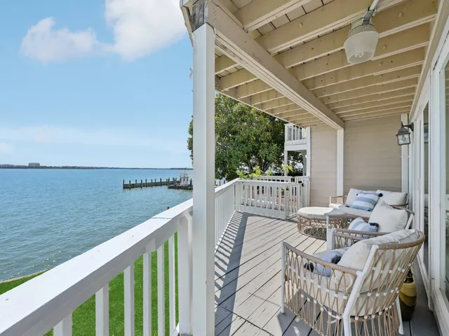 a view of balcony with furniture