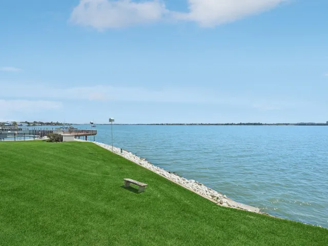 a view of a lake with a big yard