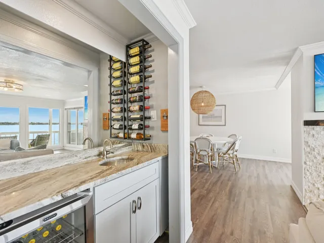 a view of dining table chairs and window