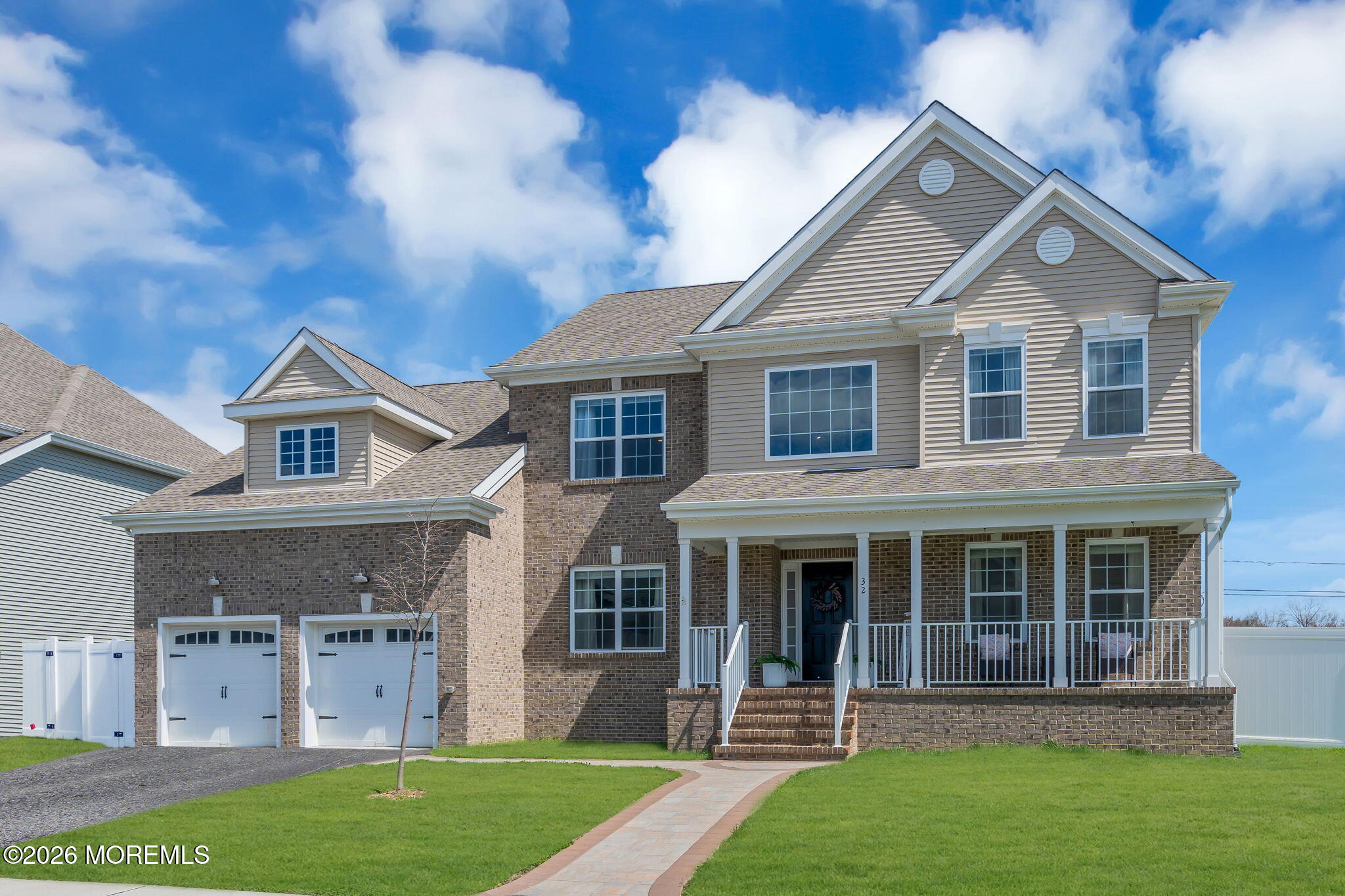 front view of a house with a yard
