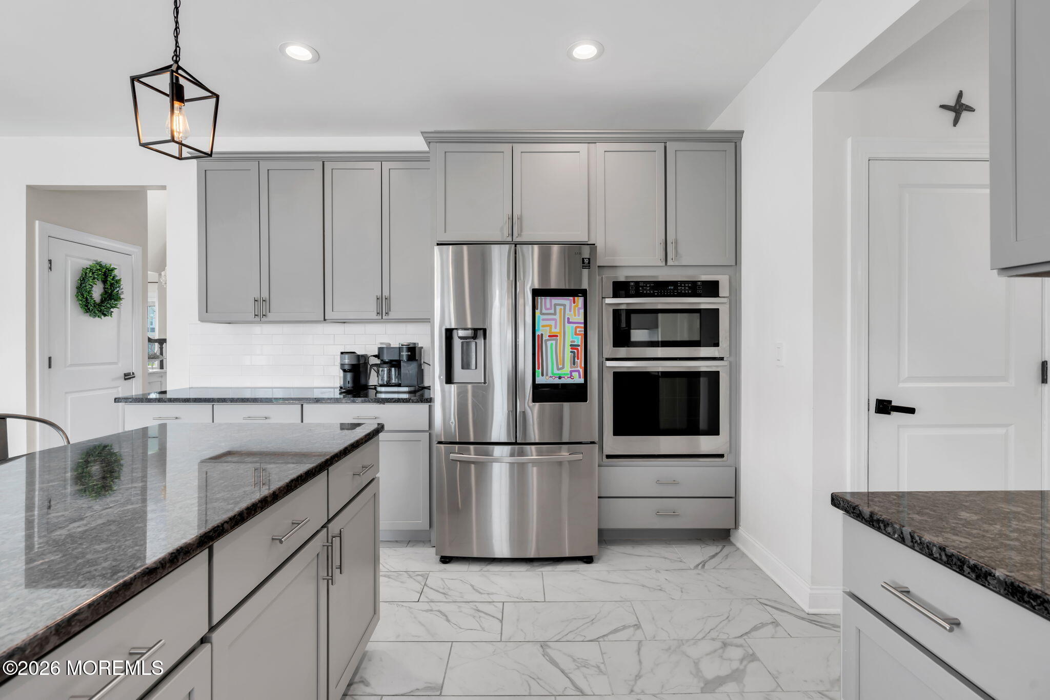 32 Tasha Lane Howell, NJ 07731 - Photo 28 of 72 a kitchen with granite countertop a refrigerator and a sink