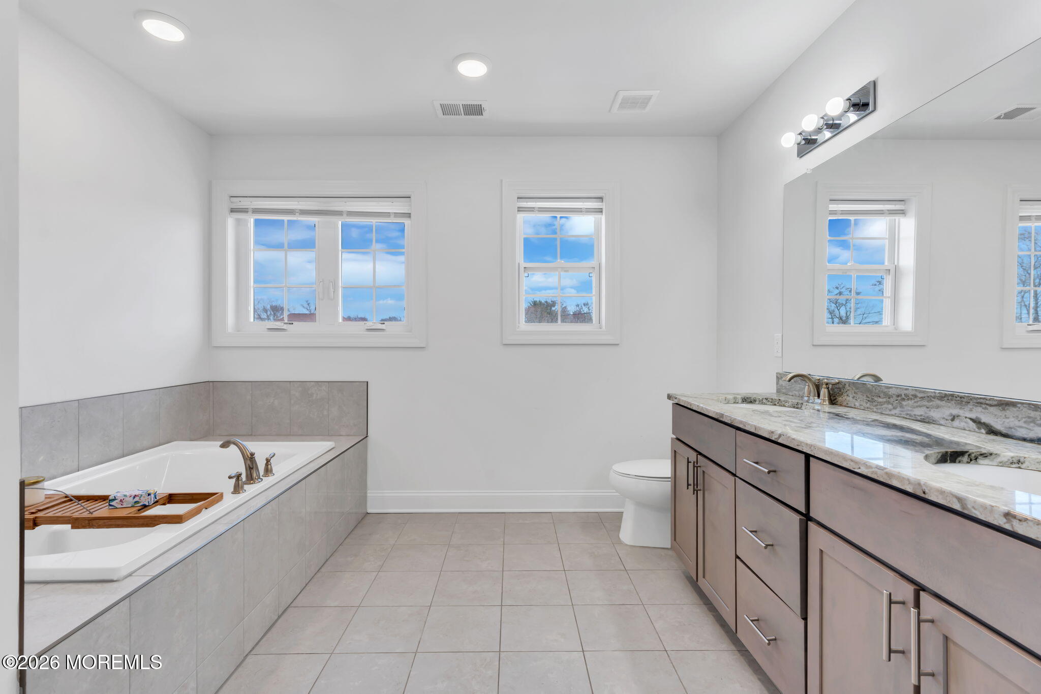 32 Tasha Lane Howell, NJ 07731 - Photo 37 of 72 a bathroom with a granite countertop sink a toilet and bathtub