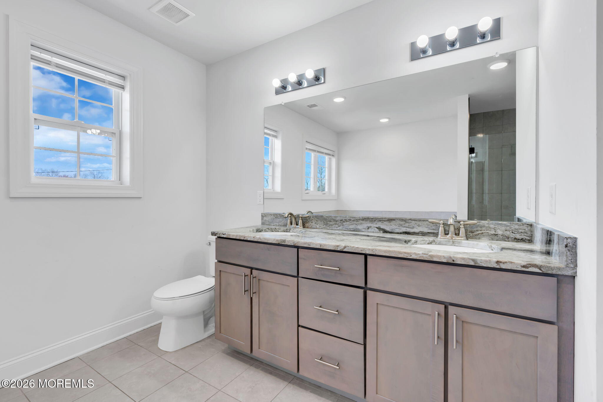 32 Tasha Lane Howell, NJ 07731 - Photo 41 of 72 a bathroom with a granite countertop sink a toilet and a mirror