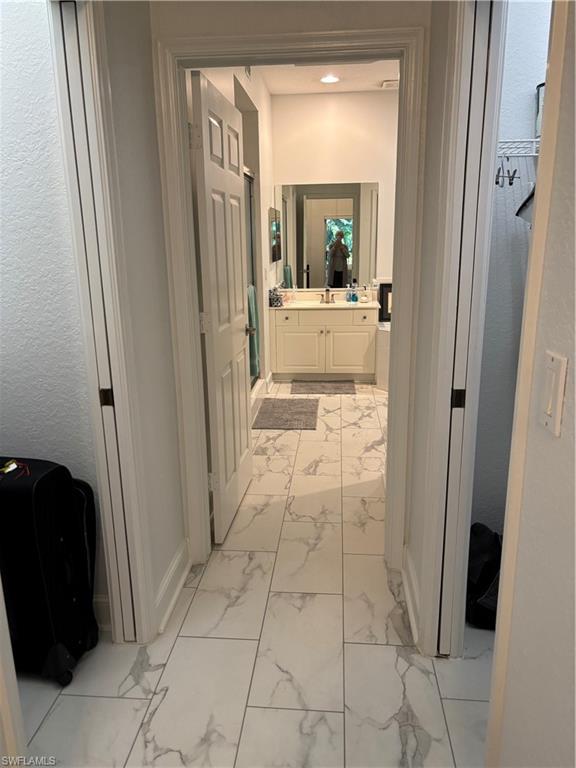1270 Shady Rest Lane, Unit 403 Naples, FL 34103 - Photo 16 of 24 a view of a hallway and a livingroom with furniture