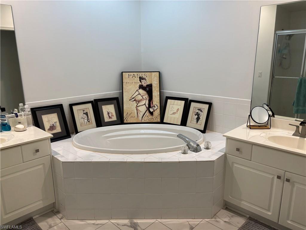 1270 Shady Rest Lane, Unit 403 Naples, FL 34103 - Photo 17 of 24 a utility room with dryer and washer