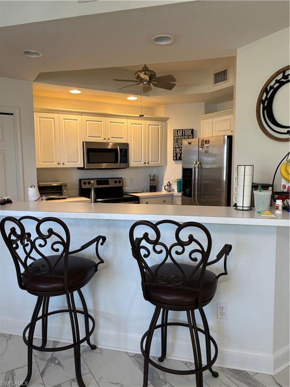 1270 Shady Rest Lane, Unit 403 Naples, FL 34103 - Photo 10 of 24 a view of a kitchen with electric appliances