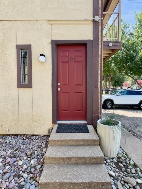 4000 Rawlins Street, Unit 101B Dallas, TX 75219 - Photo 25 of 27 a front view of a house with a yard