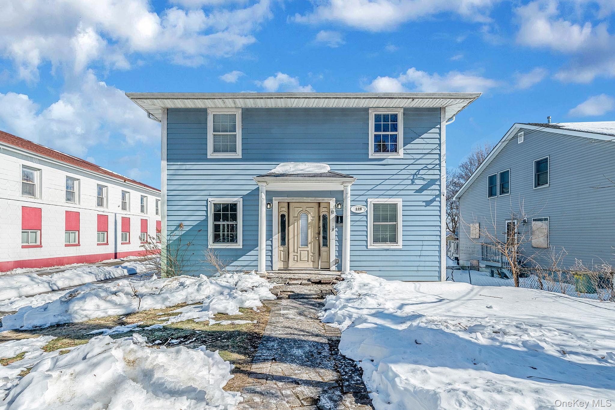 128 Bethune Boulevard Spring Valley, NY 10977 - Photo 1 of 34 a front view of a house with a yard