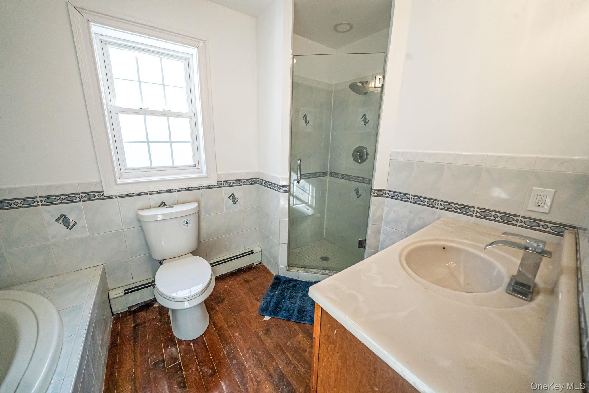 128 Bethune Boulevard Spring Valley, NY 10977 - Photo 17 of 34 a bathroom with a sink toilet and shower