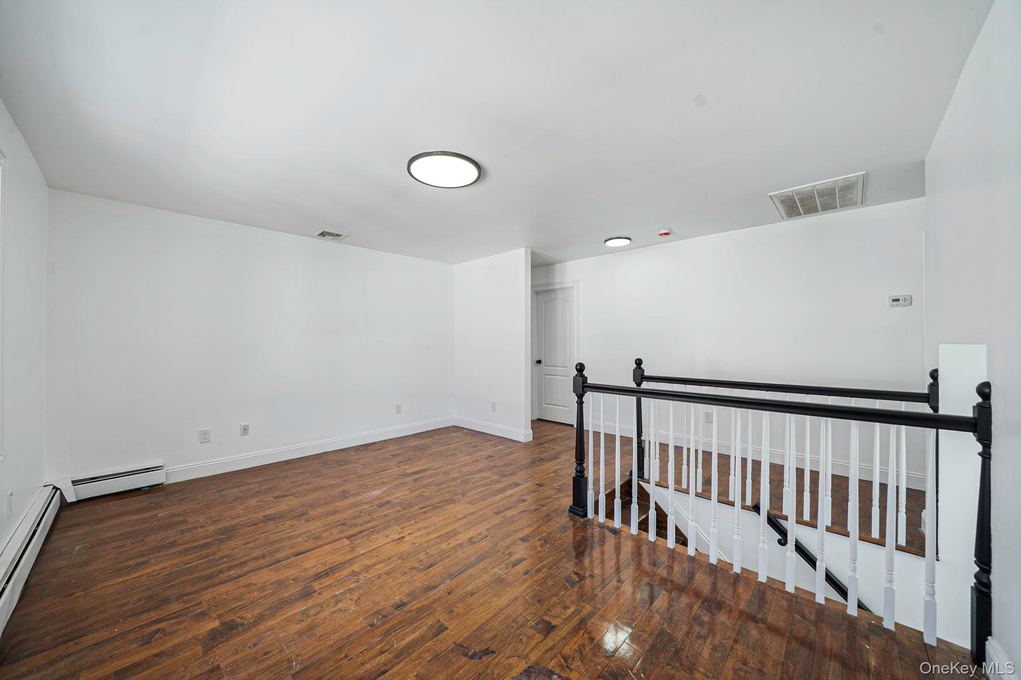 128 Bethune Boulevard Spring Valley, NY 10977 - Photo 25 of 34 a view of hallway with wooden floor