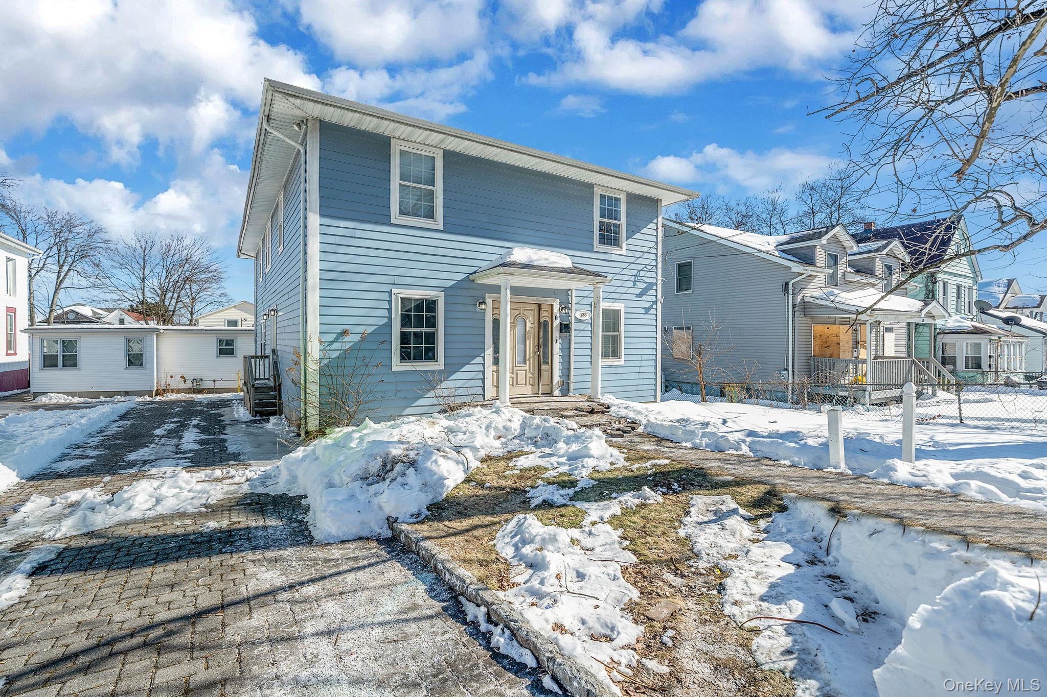 128 Bethune Boulevard Spring Valley, NY 10977 - Photo 3 of 34 a front view of a house with a yard