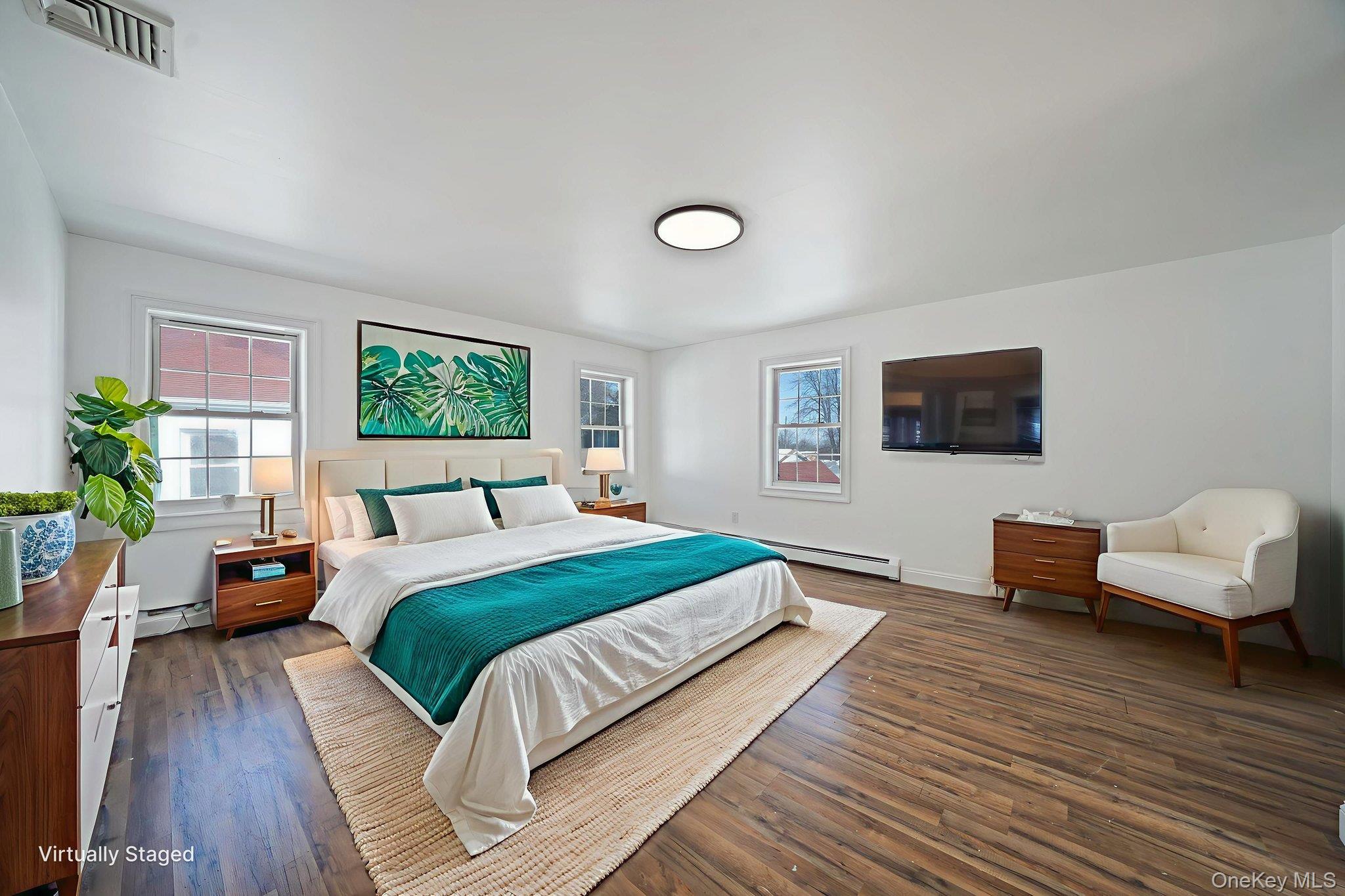 128 Bethune Boulevard Spring Valley, NY 10977 - Photo 32 of 34 a bedroom with a bed and a couch