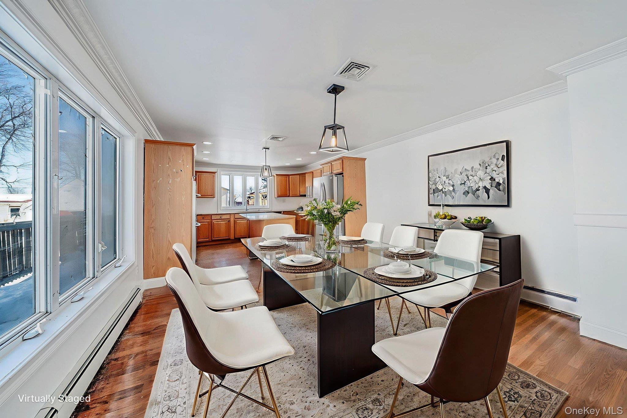 128 Bethune Boulevard Spring Valley, NY 10977 - Photo 7 of 34 a dining room with furniture a rug and wooden floor