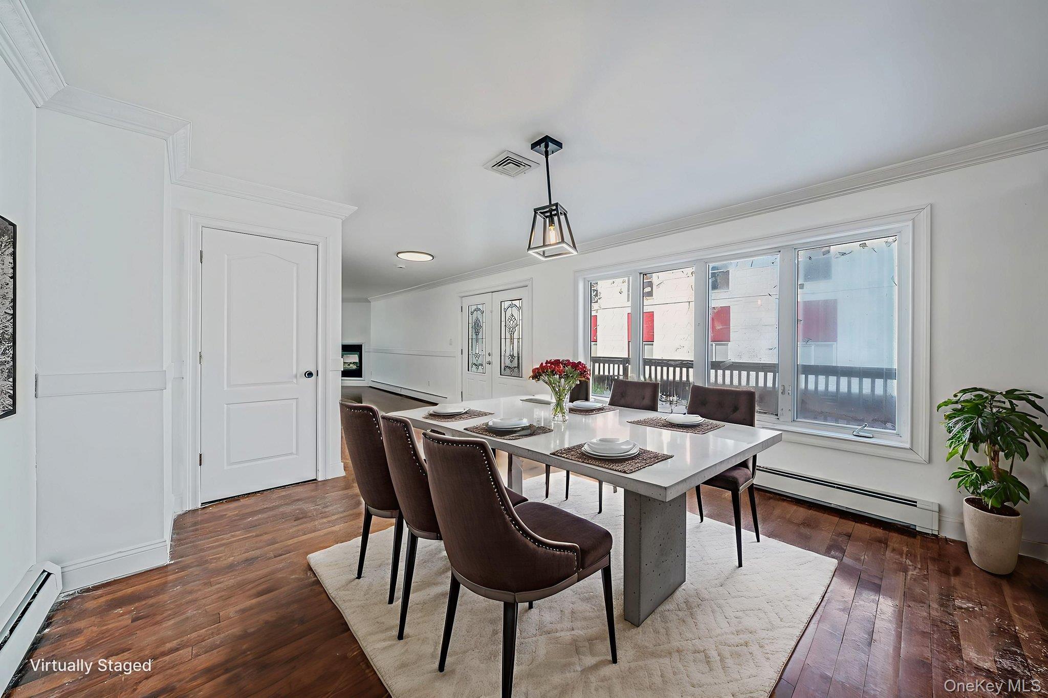 128 Bethune Boulevard Spring Valley, NY 10977 - Photo 8 of 34 a view of a dining room with furniture and wooden floor