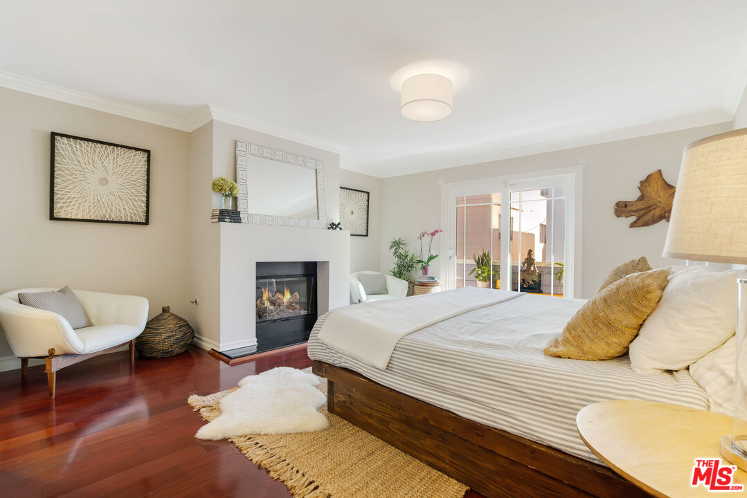 20 Ketch Street, Unit 1 Marina del Rey, CA 90292 - Photo 8 of 17 a bedroom with a bed and a fireplace
