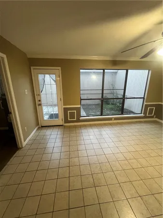 a spacious bathroom with a sink a toilet and a mirror