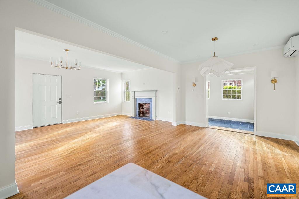 809 East Jefferson Street Charlottesville, VA 22902 - Photo 13 of 50 an empty room with wooden floor and windows