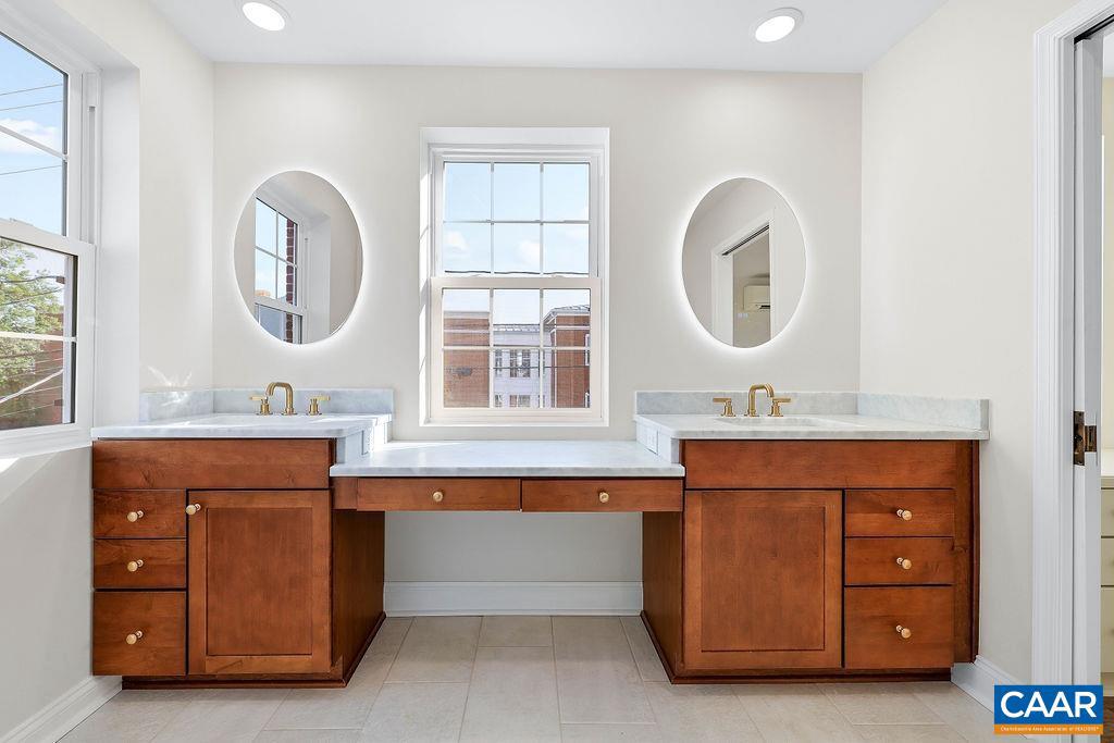 809 East Jefferson Street Charlottesville, VA 22902 - Photo 35 of 50 a bathroom with a sink a mirror and a window