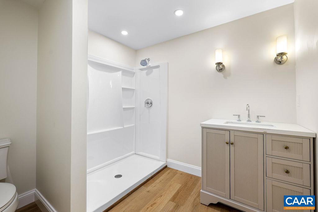 809 East Jefferson Street Charlottesville, VA 22902 - Photo 43 of 50 a bathroom with a sink a toilet and shower