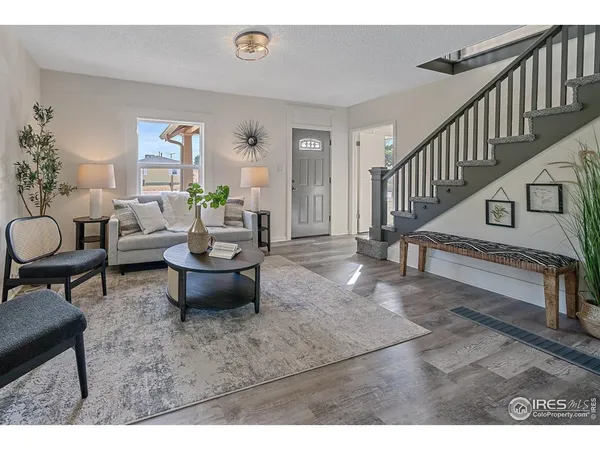 a living room with furniture and a table