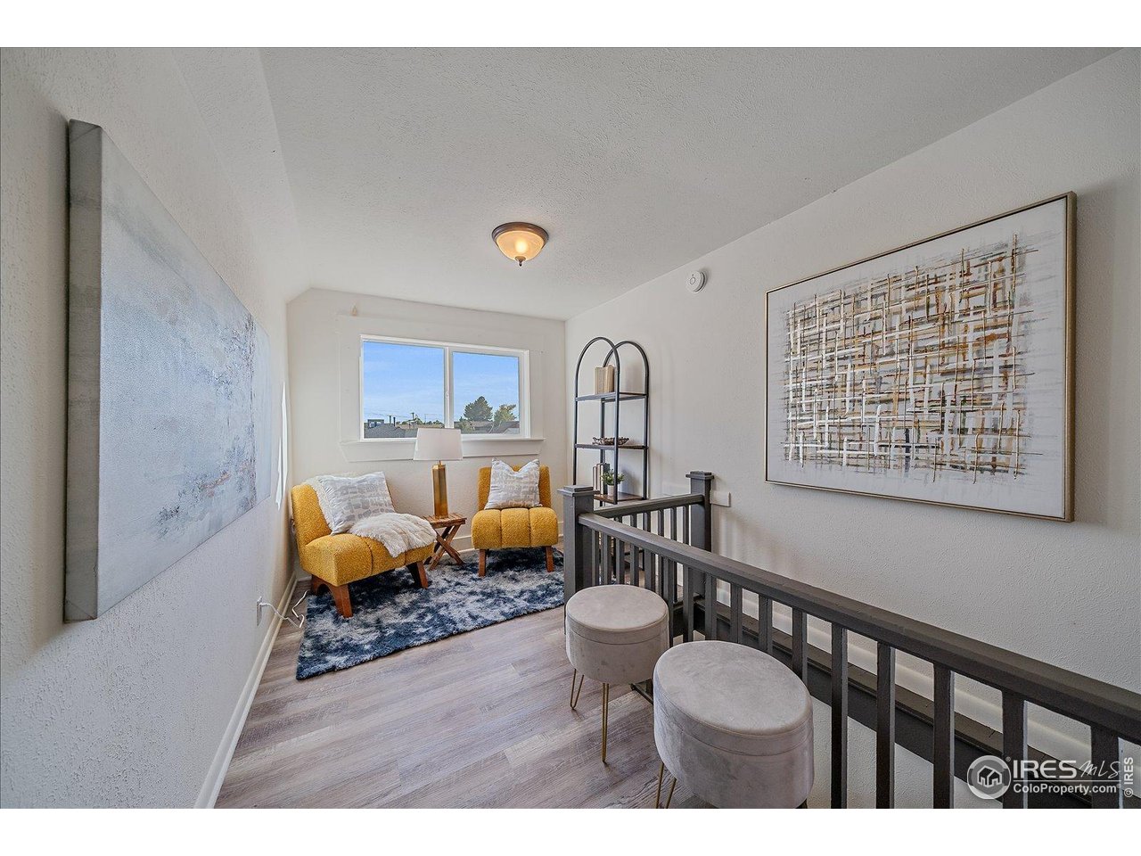 131 3rd Street Dacono, CO 80514 - Photo 13 of 28 a living room with furniture a rug and a window
