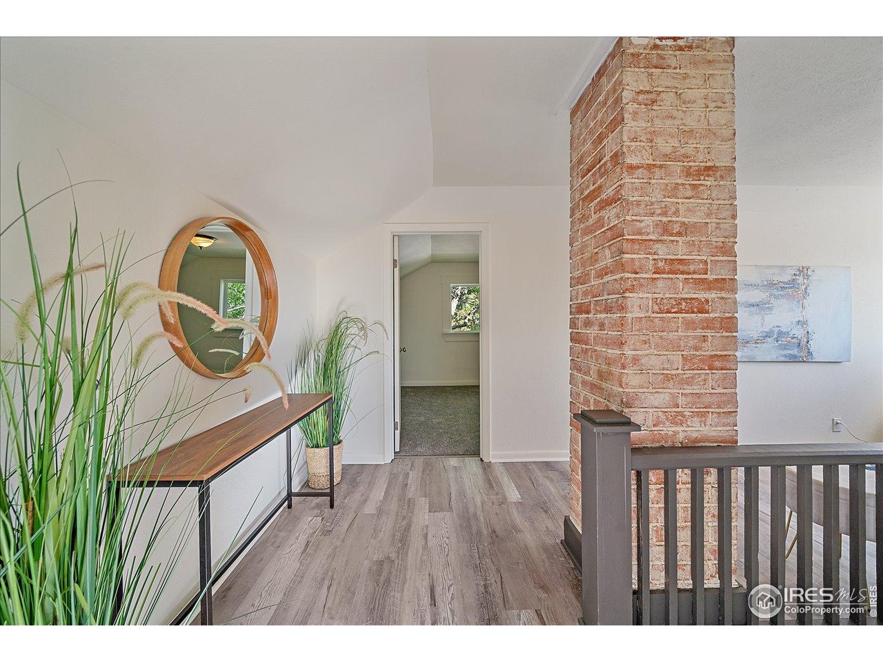 131 3rd Street Dacono, CO 80514 - Photo 14 of 28 a view of entryway with wooden floor