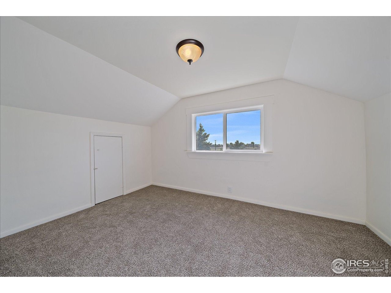 131 3rd Street Dacono, CO 80514 - Photo 15 of 28 a view of an empty room