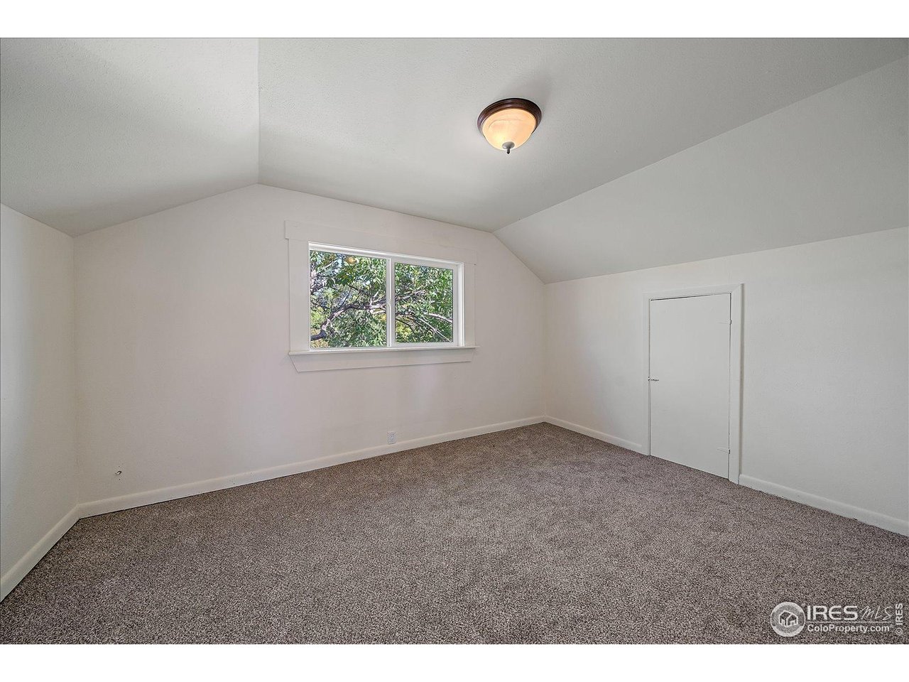 131 3rd Street Dacono, CO 80514 - Photo 16 of 28 an empty room with windows